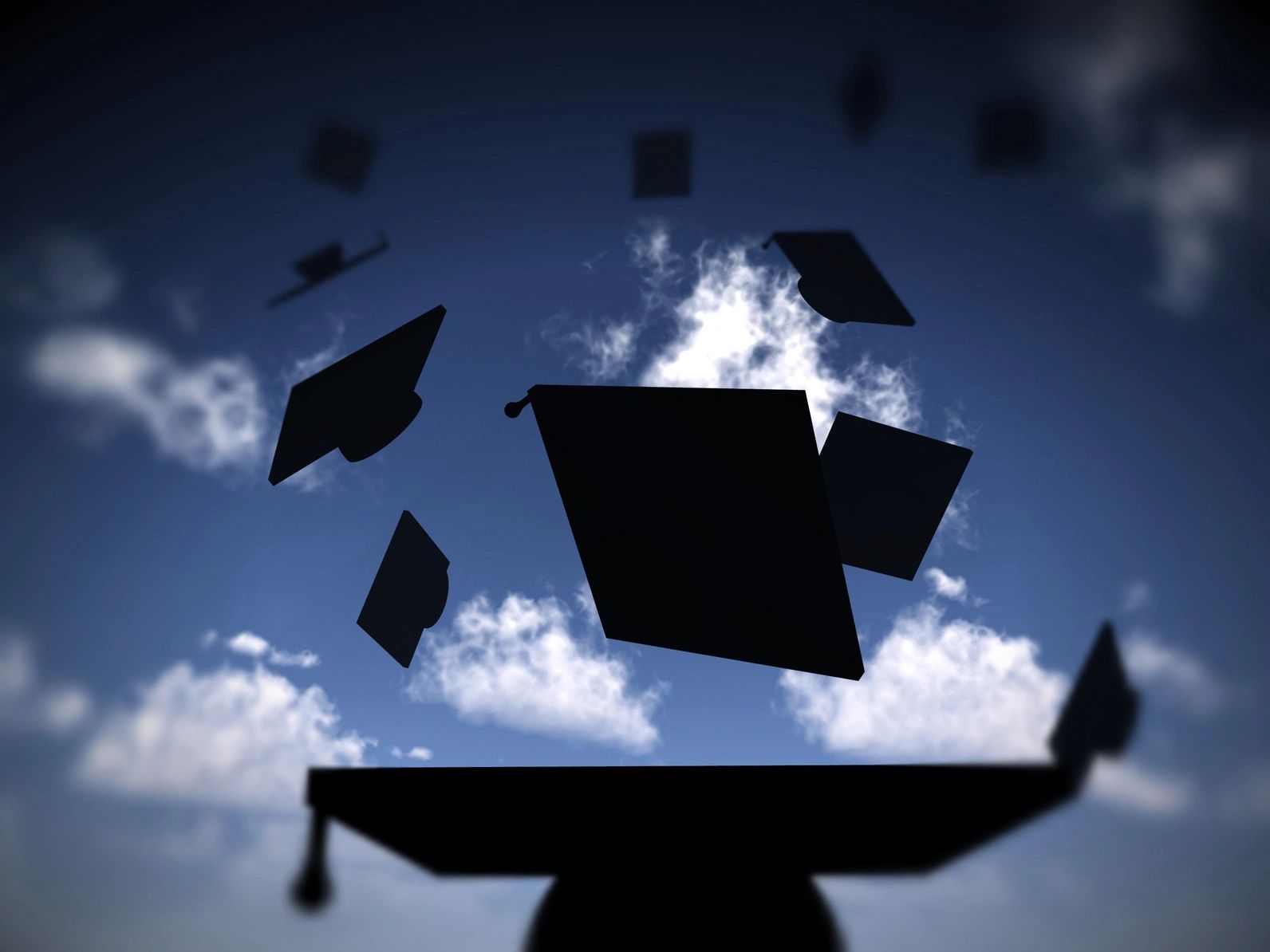 Graduation caps tossed into the sky